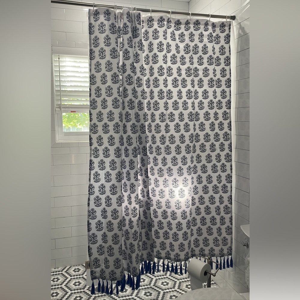 John Robshaw white and blue shower curtain with tassles. Spectacular.